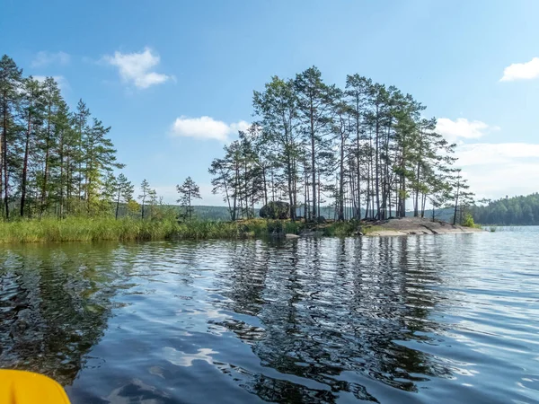 Kayaking on the calm Saimaa lake in Finland