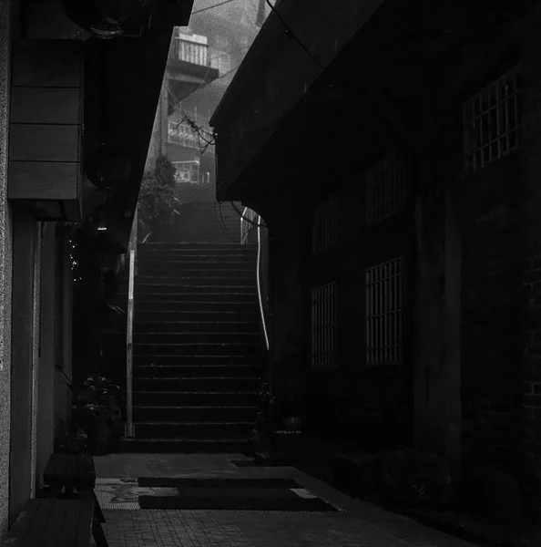 A back alley and staircase in the Taiwanese village of Jiufen shot with black and white film photography