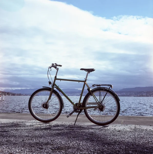 A bike standing by the lake of Zurich, shot with analogue slide film technique