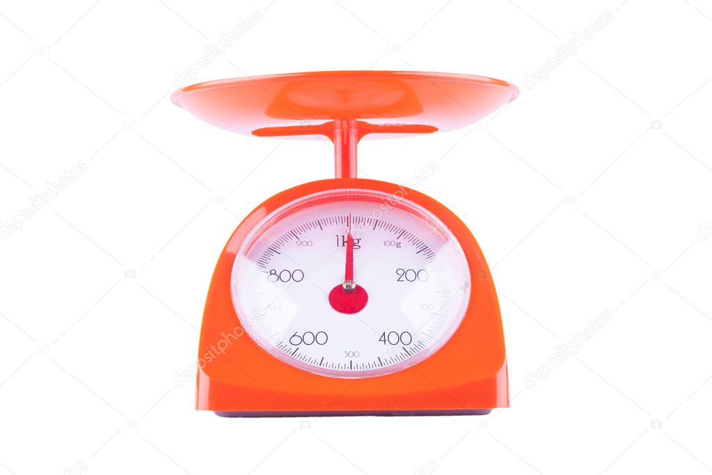 orange weighing scales with pan and dial on white background kitchen equipment object isolated