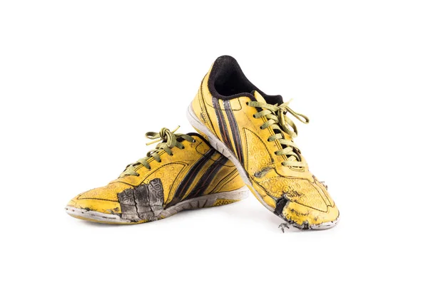  Beyaz arka plandaki eski topuklu ayakkabı bağcığı futbol yazılımı nesnesi izole edilmiş.