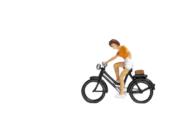 Miniature people travellers with bicycle isolate on white background — Stock Photo, Image