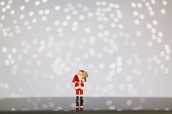 Miniature People Santa Claus Carrying Bag Bokeh Background Merry Christmas — Stock Photo, Image