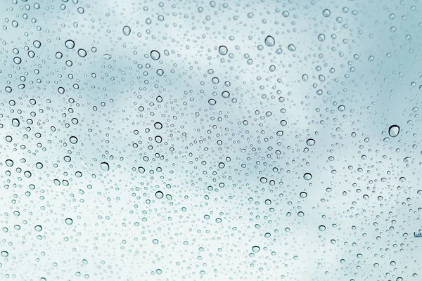 Raindrops on window glasses surface