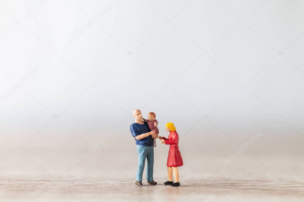 Miniature people : Parents with children walking outdoor