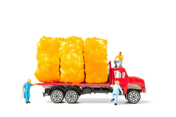 Miniature people make Sushi Rolls on truck isolated on white background , Food delivery concept