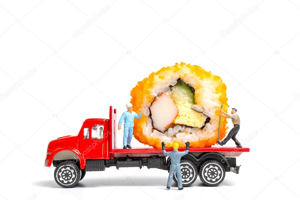 Miniature people make Sushi Rolls on truck isolated on white background , Food delivery concept