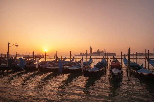 Famous gondolas at sunrise. Venice, Italy. picture with long exp — Stock Photo, Image