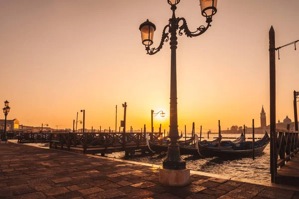 Famous gondolas at sunrise. Venice, Italy. picture with long exp — Stock Photo, Image