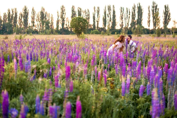Happy Romantic Couple Walking Holding Hands Field Lupines — Stock Photo, Image