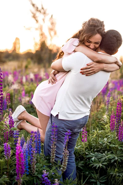 Happy Romantic Couple Hugging Field Lupines — Stock Photo, Image