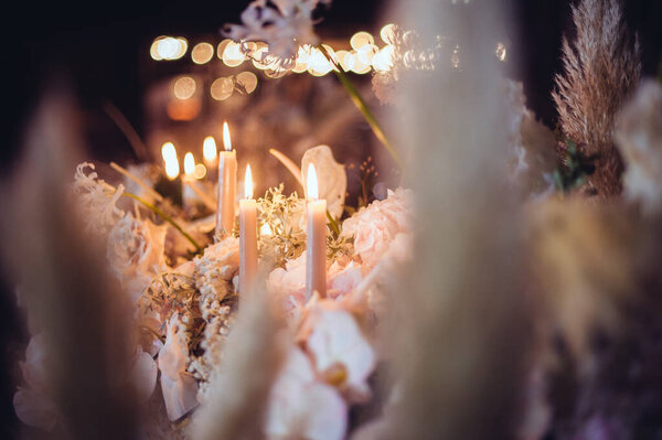 rustic wedding decorations with flowers and candles. banquet decor. picture with soft focus