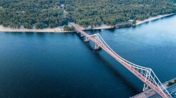 glass pedestrian and bicycle bridge. touristic place. Kiev, Ukraine. drone shot, bird's-eye, aerial view