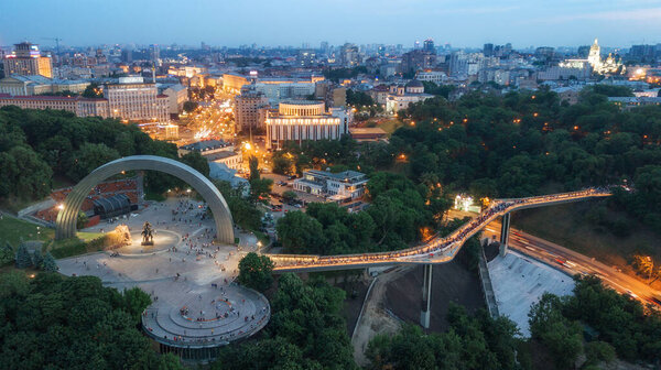 glass pedestrian and bicycle bridge. touristic place. Kiev, Ukraine. drone shot, bird's-eye, aerial view