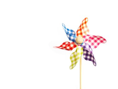 Close up colorful pinwheel over white background.  clipart