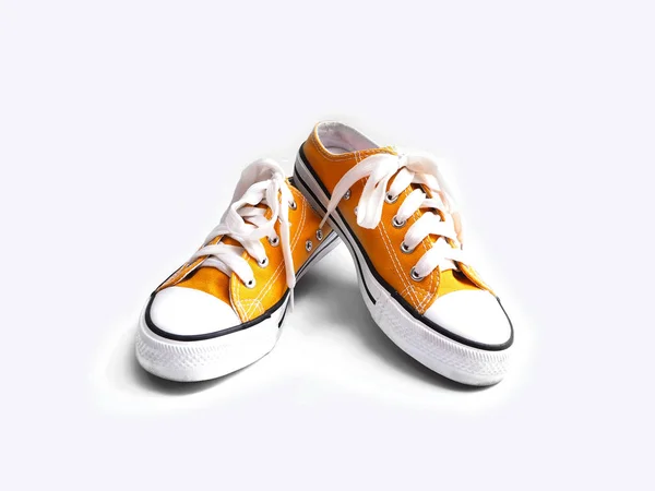 Close up sneakers gialle isolate su sfondo bianco . — Foto Stock