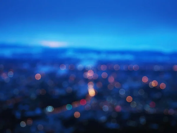Abstraktní rozmazané noční světlo bokeh z města. — Stock fotografie