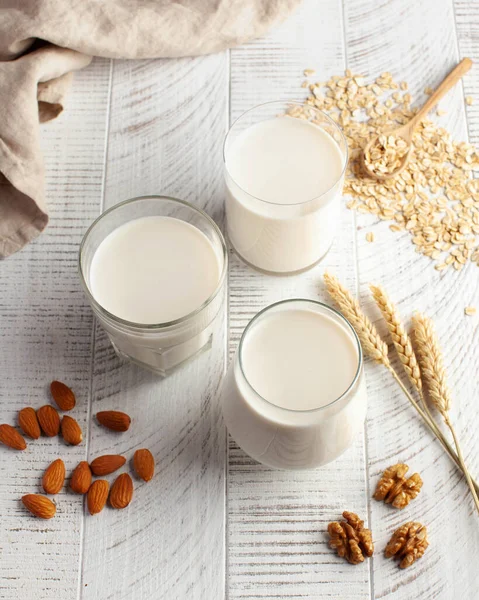 Different types of lactose-free milk, an alternative to dairy products. Almond and oat milk. High quality photo