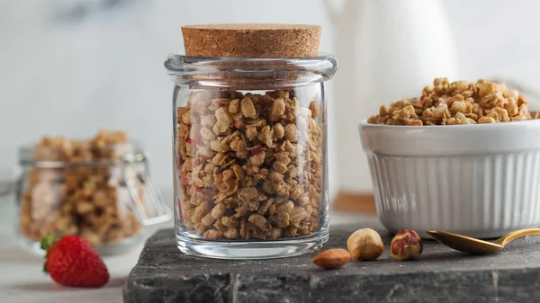 Banner Homemade granola with nuts and strawberries on the Board. The concept of Breakfast