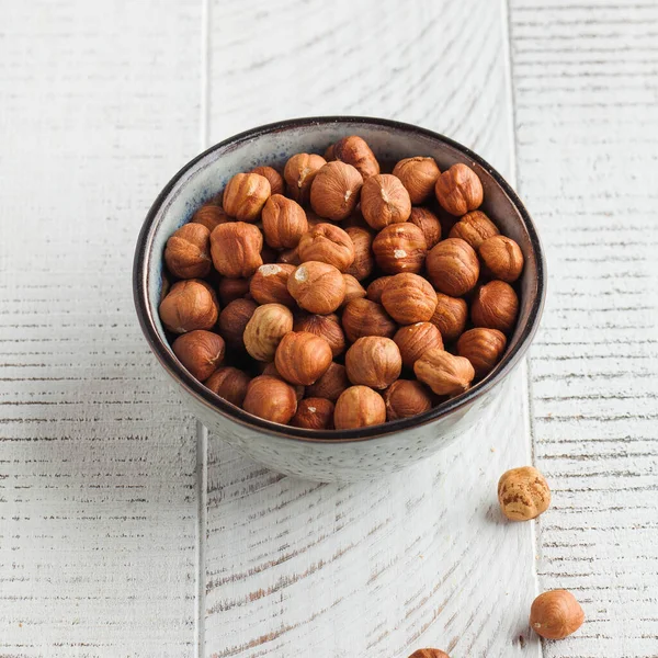 Handful Hazelnuts Grey Bowl White Wooden Background Healthy Snacks Nuts — Stock Photo, Image