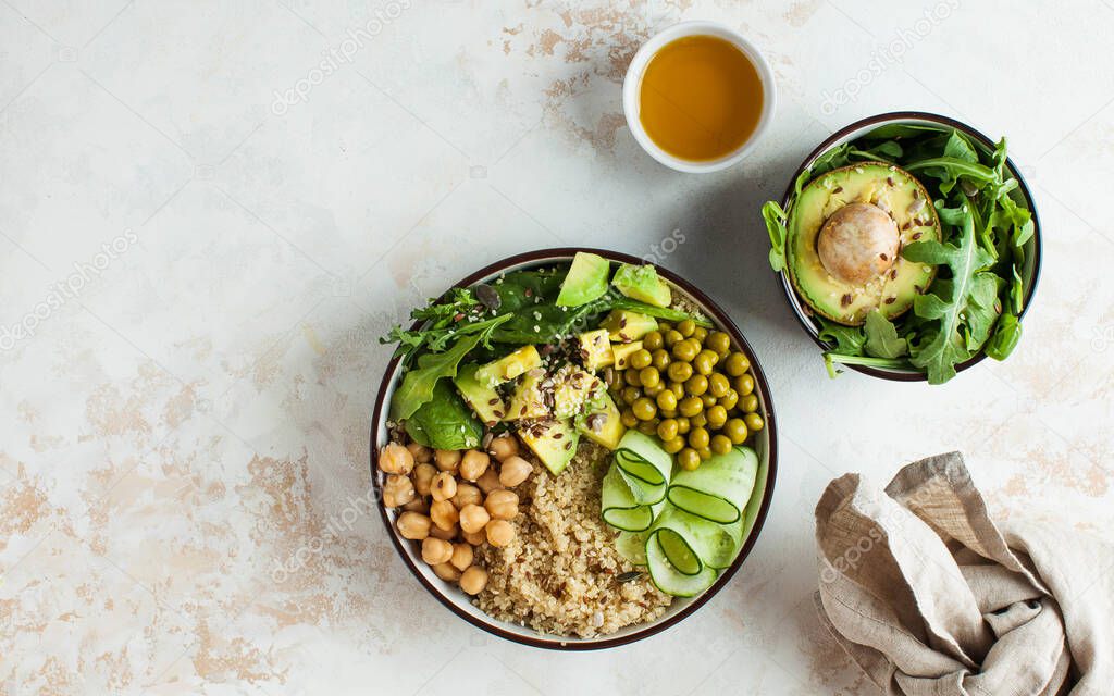 Healthy vegetable lunch from the Buddha bowl with quinoa, avocado, chickpeas, cucumber. The concept of a healthy food dish for vegetarians, a trend dish. High quality photo