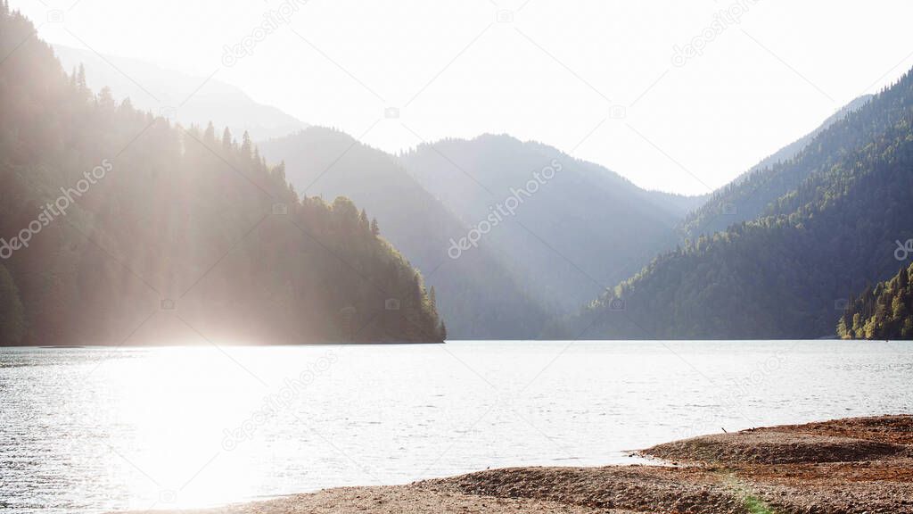 Rizza lake in the Golden hour. Tourist Attraction Of Abkhazia. Mountain lake. High quality photo
