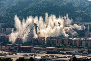 The implosion of what remained of the Morandi bridge in Genoa clipart
