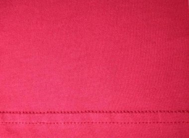 Pürüzsüz kırmızı madde. Altında dikişler var.