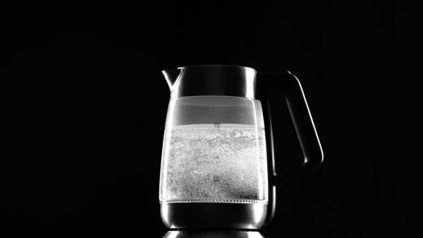 Electric kettle begins to boil. Black background — Stock Video