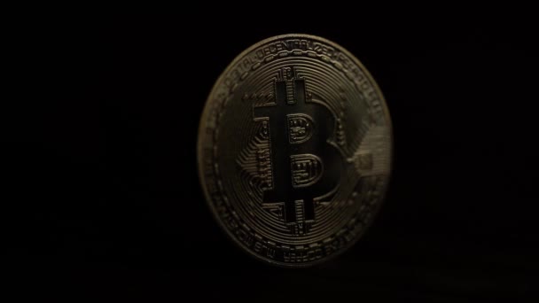 Rays of penetrating light behind one bitcoin you can see the rest. Close up — Stock Video