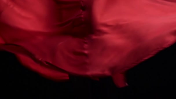 Red dress. Black background. Close up. Slow motion — Stock Video