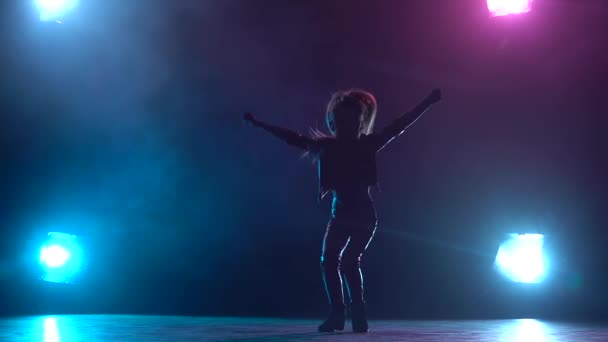 Baby dances jazz funk. Multicolor smoke background. Silhouette. Light from behind. Slow motion — Stock Video