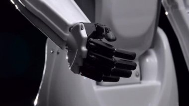 Robotlar el onun parmak Merhaba taşır. Siyah arka plan. Yakın çekim