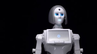 El sallayarak veda bir robot. Siyah arka plan