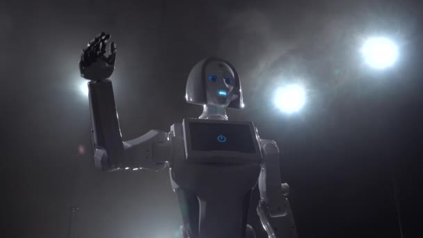Mano de robot saludando adiós. Fondo de humo negro — Vídeo de stock