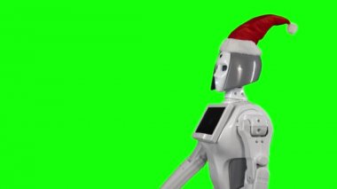 Noel Baba şapkası giyen robot bir el hareketi için arıyor. Yeşil ekran. Yan görünüm