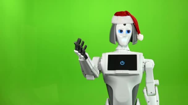 빨간 모자에 로봇 안녕 물결치는. 녹색 화면입니다. 슬로우 모션 — 비디오