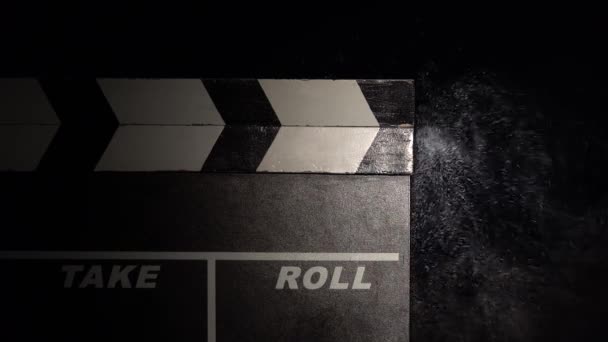 Clapper board close up. Black background — Stock Video