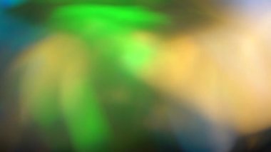 Mavi yeşil ve turuncu ışıklar soyut. Bokeh arka plan