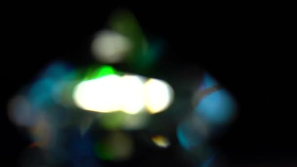 Abstrato bokeh luzes em verde azul e branco. Fundo preto — Vídeo de Stock