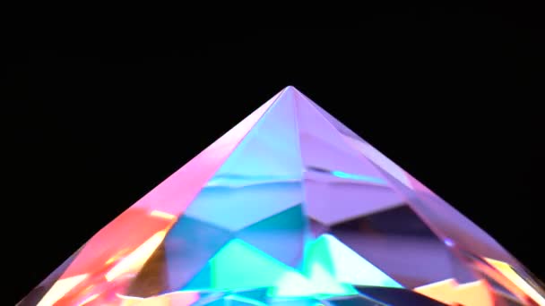 Pointed end of the diamond turns and shimmers. Black background — Stock Video