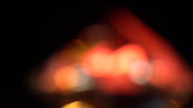 Sarı kırmızı ve turuncu ışıklar bokeh soyut. Siyah arka plan