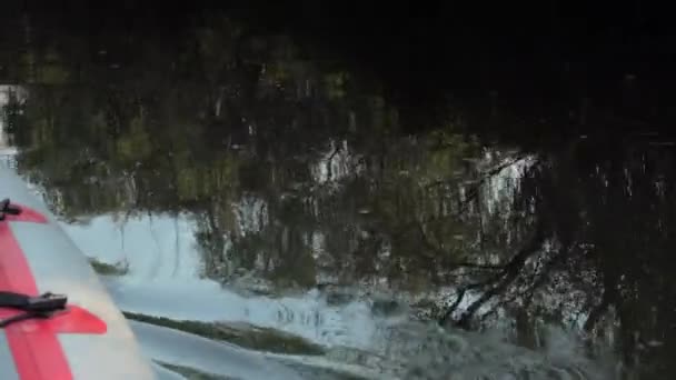 Close up shot of Mans arm in kayak with paddle — Stock Video