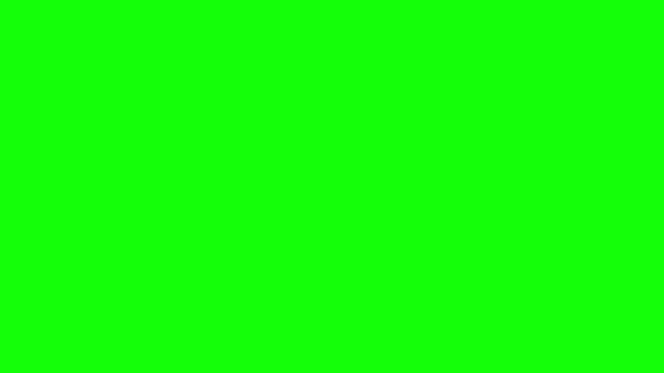 Hand turns on the remote and switches the channels. Green screen — Stock Video