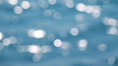 Su bokeh yüzeyi ve ışık refleks sahne arka plan