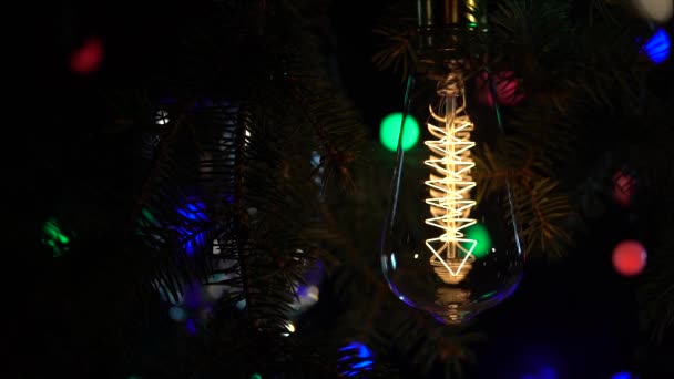 Sparklers are lit against the background of light bulbs flashy flashlights background. Close up . Slow motion — Stock Video