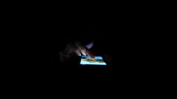 Hands touching screening scrolling . Close up. Black background — Stock Video