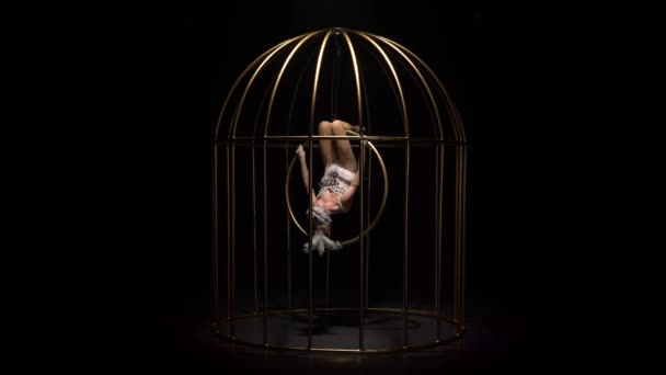 Gymnast White Suit Spinning Hoop Gold Cage Black Background — Stock Video