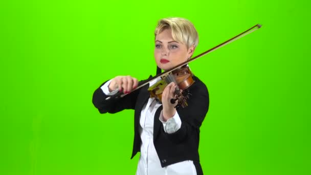 Girl plays the violin composition. Green screen — Stock Video