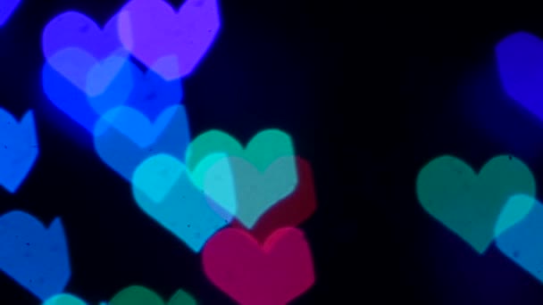 Fond d'amour avec des formes de coeur violet bouclable. Mouvement lent 